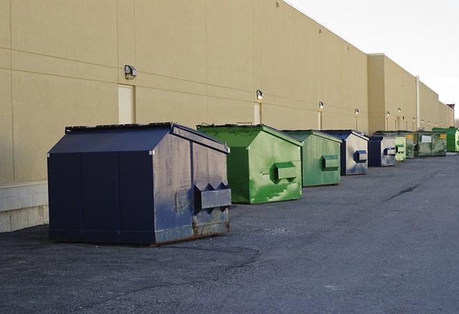 a stack of heavy construction dumpsters waiting to be emptied in Raymondville